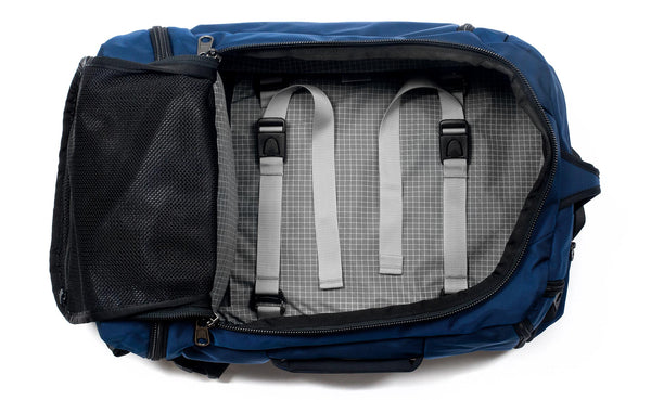 A Techonaut 30 with a Deep Blue (dark blue) exterior with Northwest Sky (light grey with white grid pattern) 200 Halcyon interior.